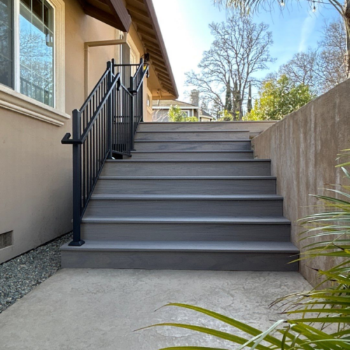 grey stairs with black railing