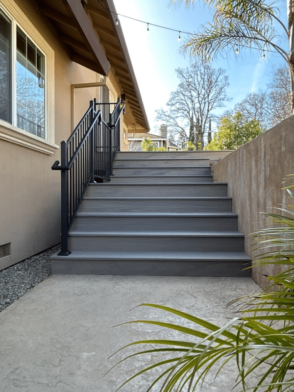 grey stairs with black railing