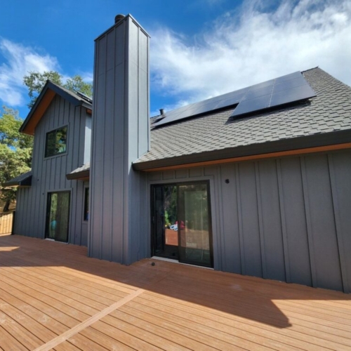 grey home with solar panels