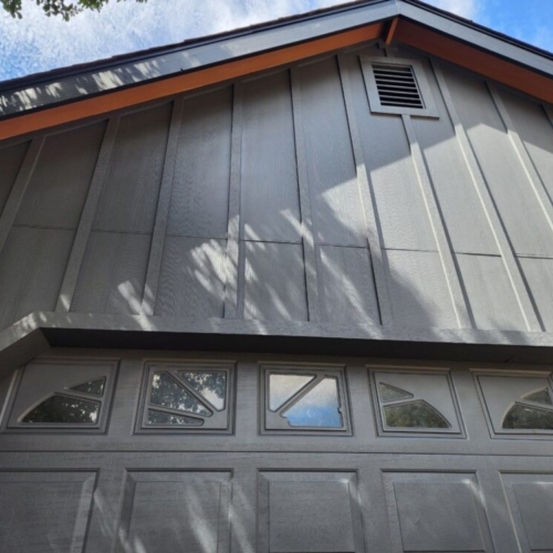 grey siding with a pitched roof