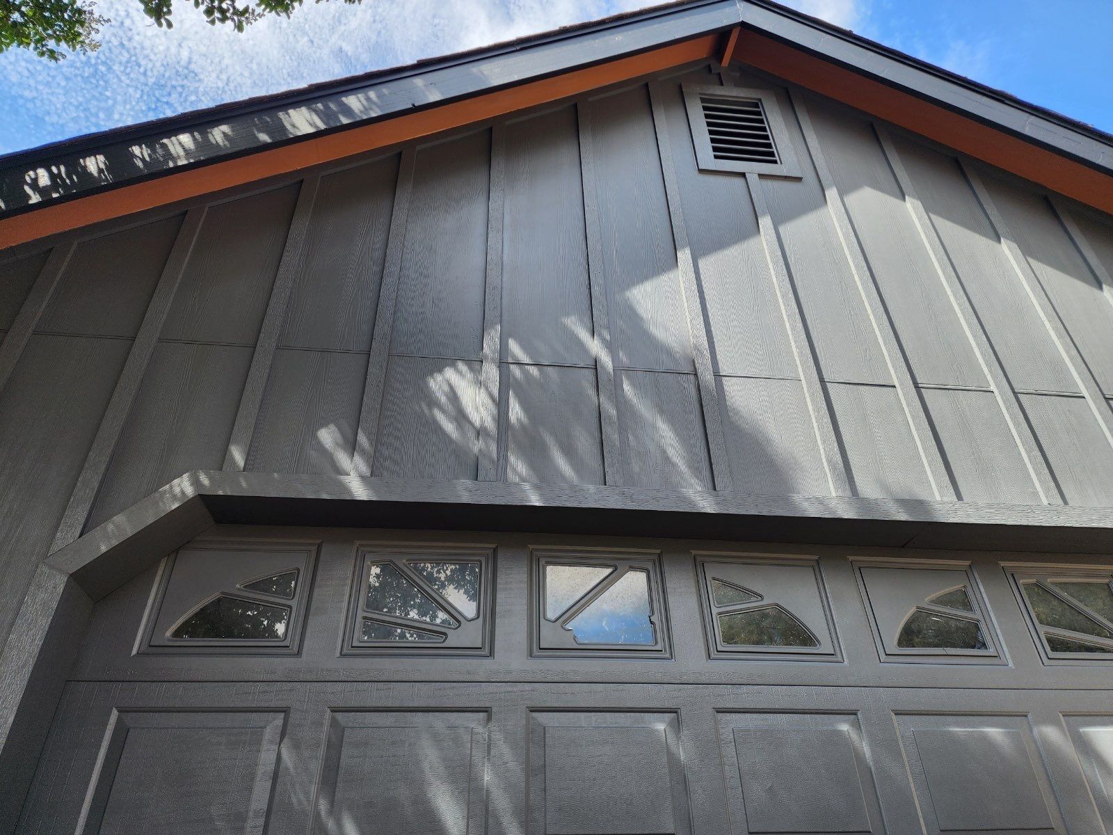 grey siding with a pitched roof