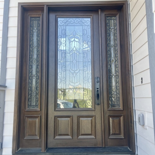 dark brown front door with glass inserts