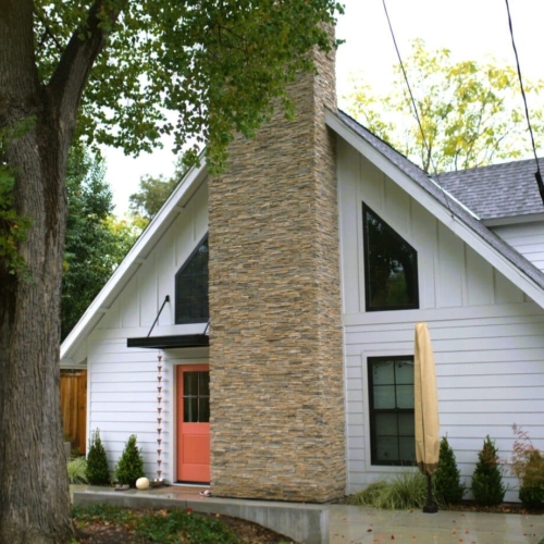 white house with large brick chimney