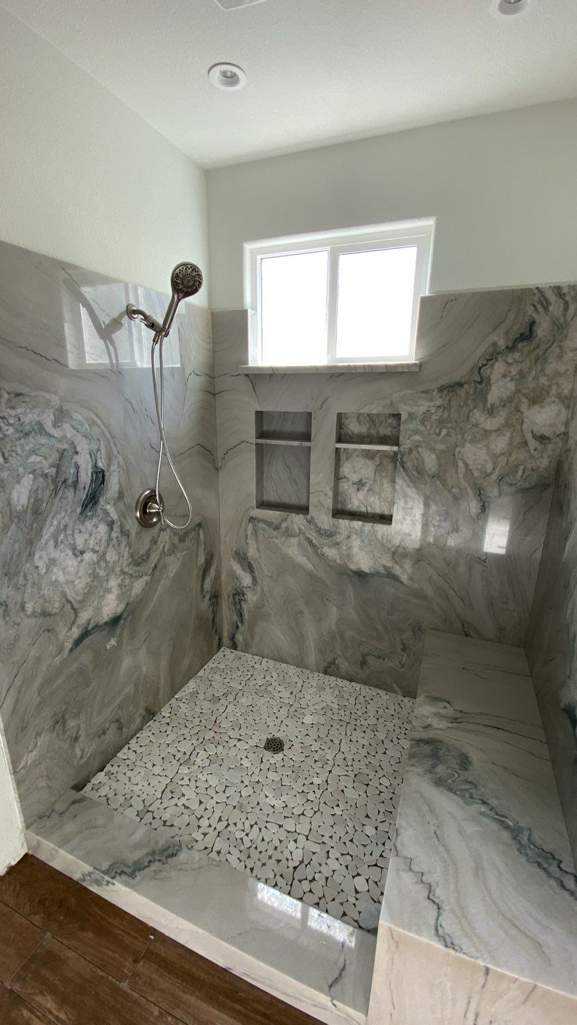 updated shower with marble slab