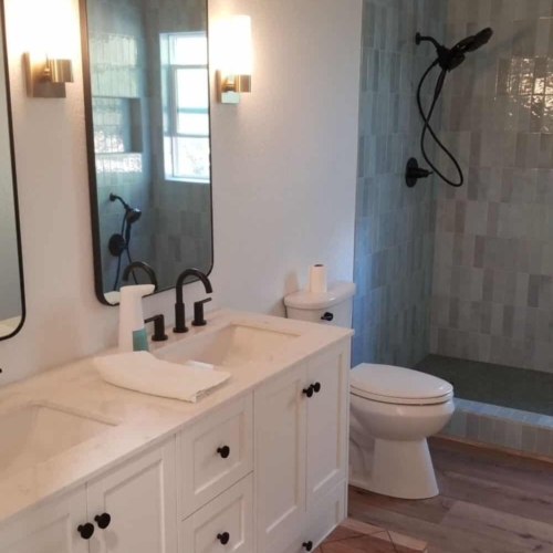 updated bathroom with vanity and shower