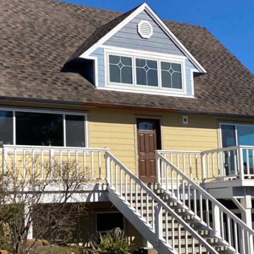 yellow and blue siding on a house