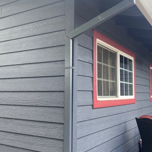 grey siding with red accents