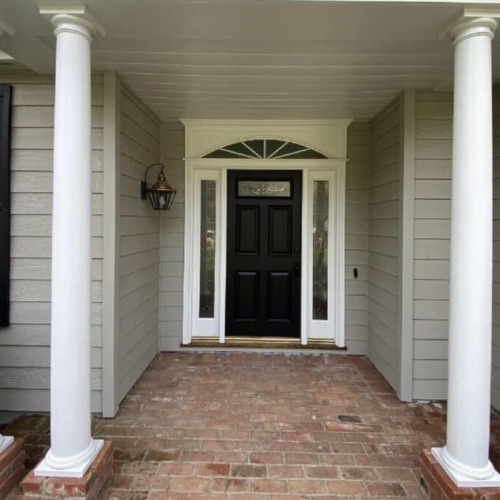 new tan siding on a traditional home